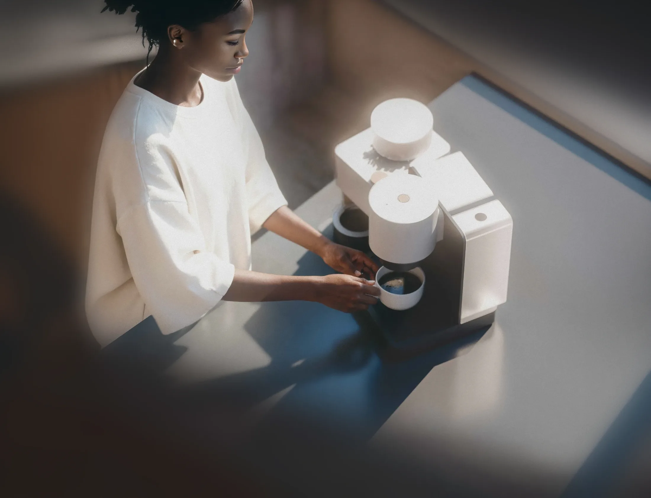 A Datum espresso machine and grinder on a kitchen counter